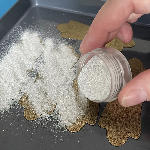 Embossing powder label